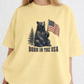 WZ_bear_born_in_the_usa_shopify_comfort_colors_1717_mockup_woman_2_butter