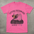 WZ_eagle_letting_freedom_ring_shopify_comfort_colors_1717_flatlay_1_mockup_crunchberry