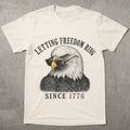 WZ_eagle_letting_freedom_ring_shopify_comfort_colors_1717_flatlay_1_mockup_ivory