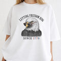 WZ_eagle_letting_freedom_ring_shopify_comfort_colors_1717_mockup_woman_2_white