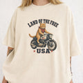WZ_motorcycle_cat_land_of_the_free_shopify_comfort_colors_1717_mockup_woman_2_ivory