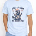 WZ_raccoon_stars_and_stripes_forever_shopify_comfort_colors_1717_mccaffrey_mockup_chambray