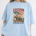 WZ_tric_freedom_never_goes_extinct_white_shopify_comfort_colors_1717_mockup_woman_2_chambray