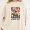 WZ_tric_freedom_never_goes_extinct_white_shopify_comfort_colors_1717_mockup_woman_2_ivory